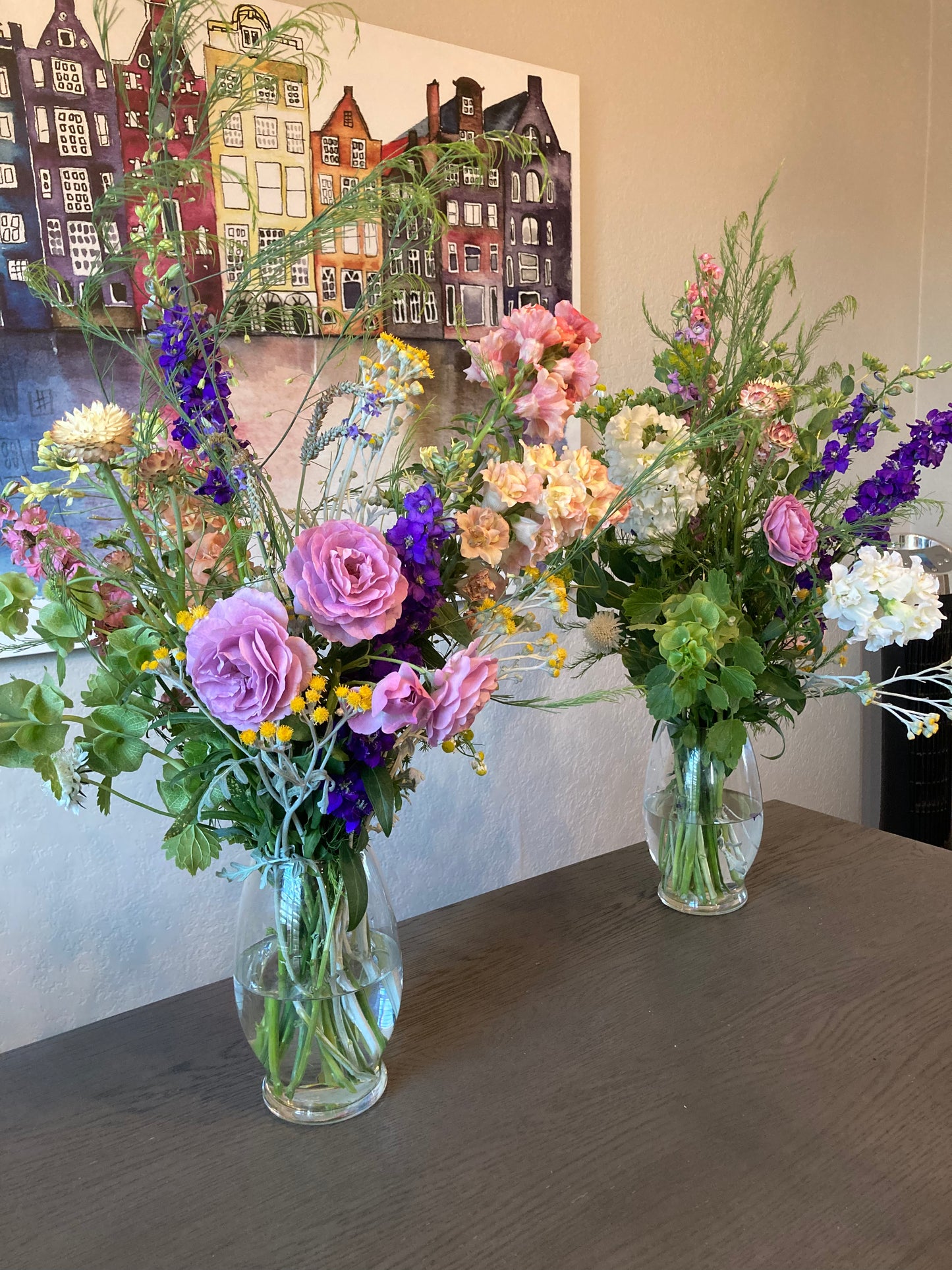 examples of large bouquets with bells of ireland, stock, snapdragons, roses, strawflower, asparagus ferns and dusty miller